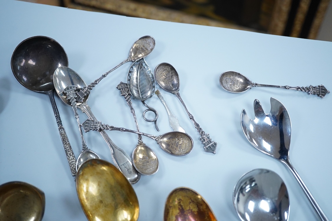 A small quantity of assorted 19th century and later silver and white metal flatware, including teaspoons, commemorative spoons, ladles, sugar tongs, pickle fork, a pair of Swedish salad serves, a similar butter knife and